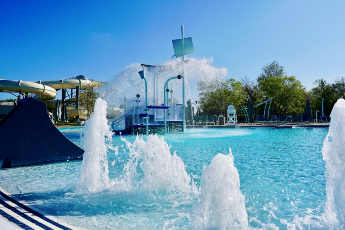 family pool with water feature